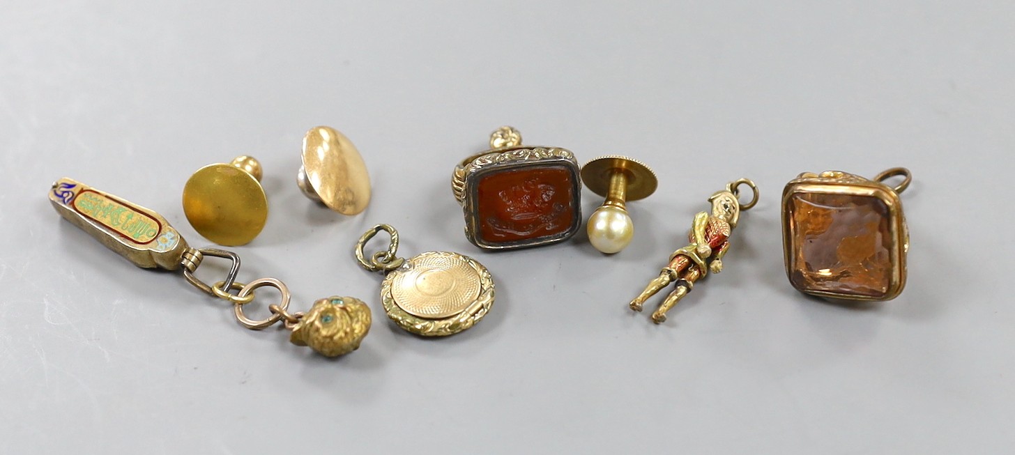 Mixed small jewellery including three yellow metal dress studs, an Egyptian 'mummy' charm, two 19th century gilt metal and semi-precious gem set fob seals and two other items including a gilt metal locket.